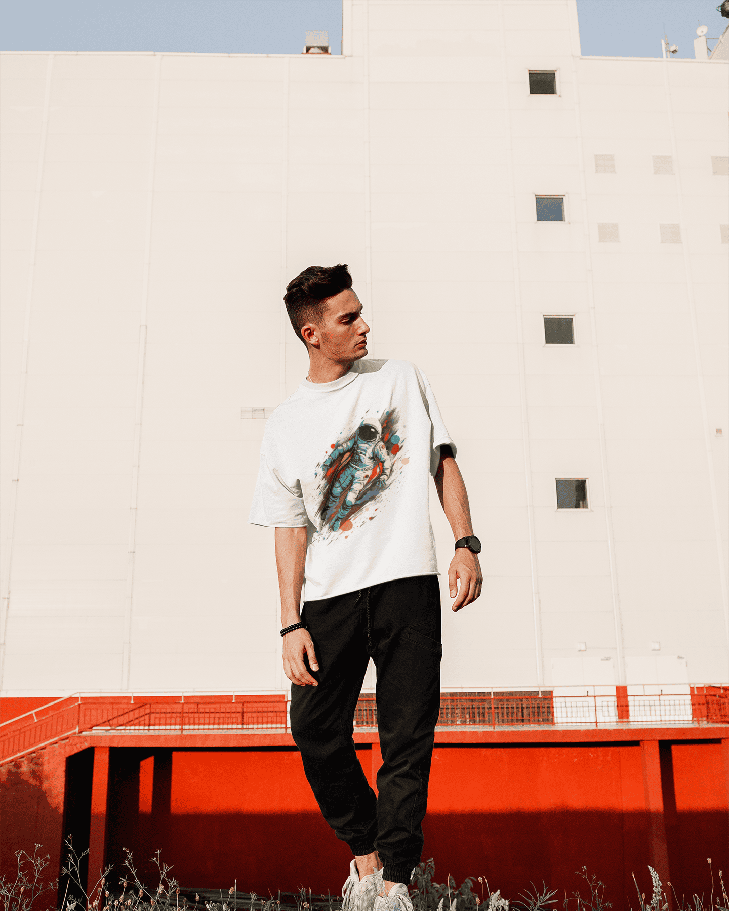 Astronaut floating in zero gravity with colorful cosmic streaks – space-inspired t-shirt from Spacebond.